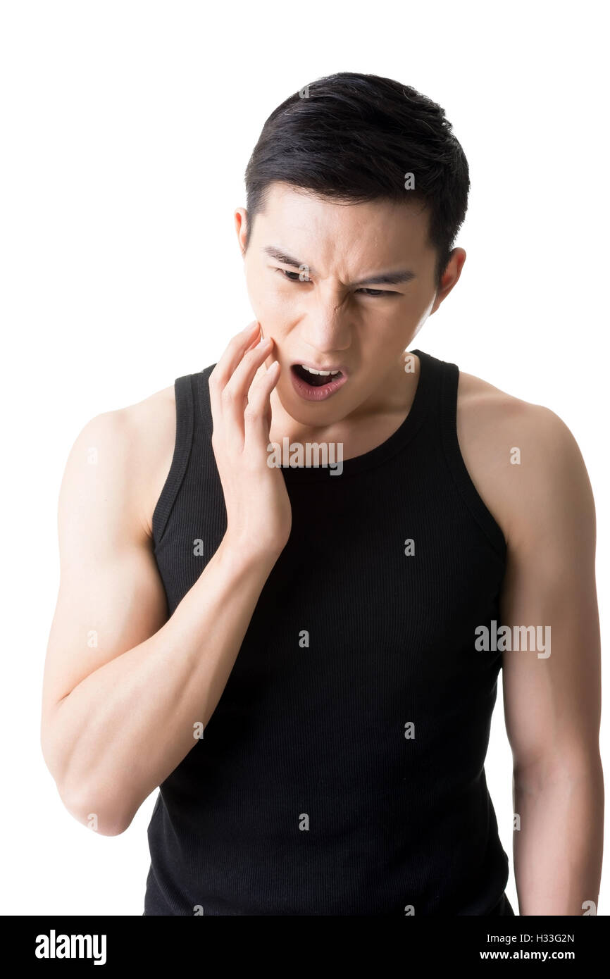 Young Asian man with toothache Stock Photo