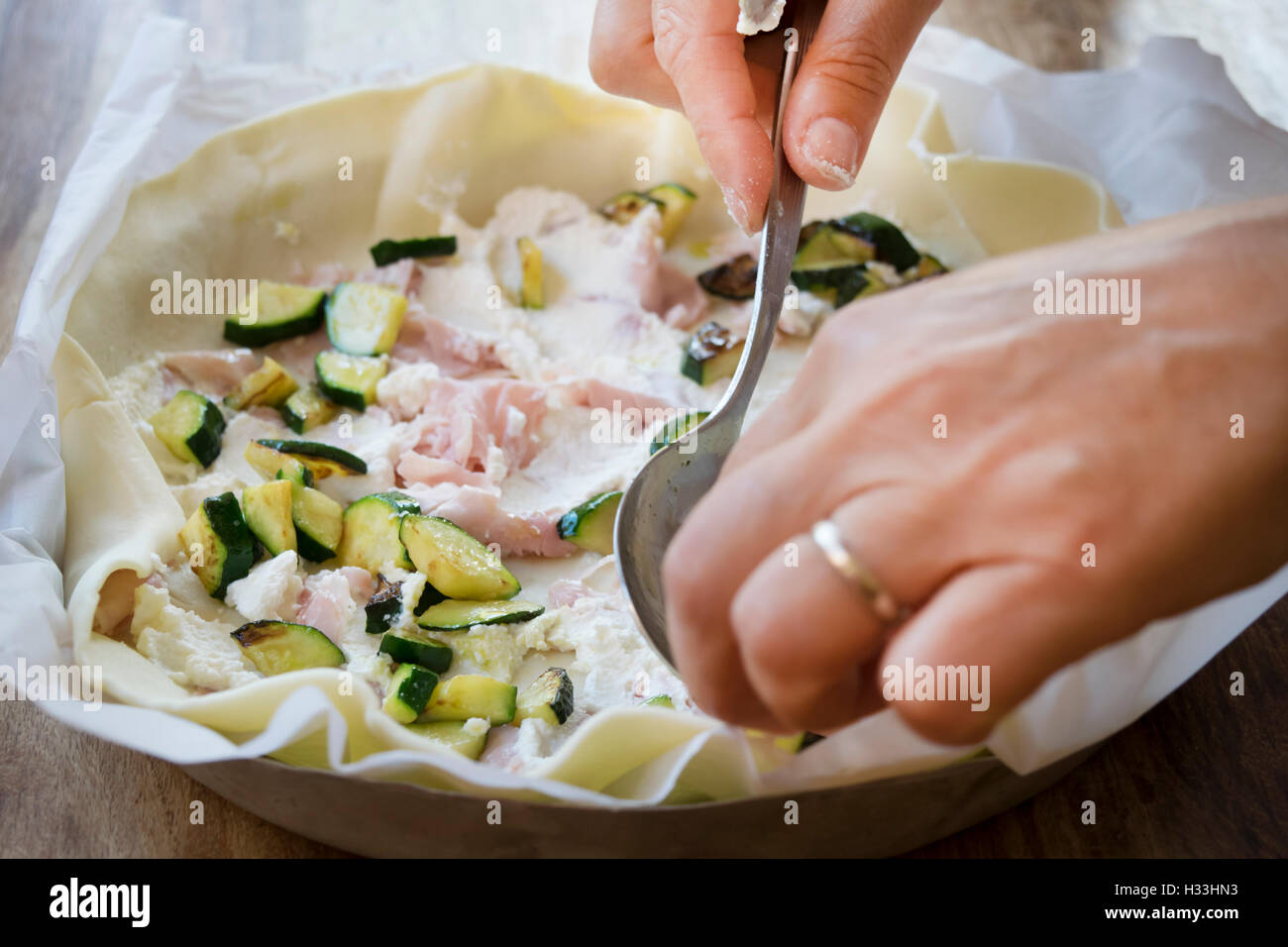 preparation of a quiche stuffing with variety of vegetables Stock Photo