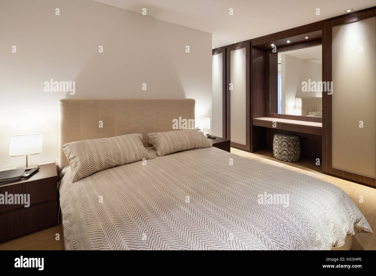 bedroom of luxury house, comfortable double bed Stock Photo Alamy