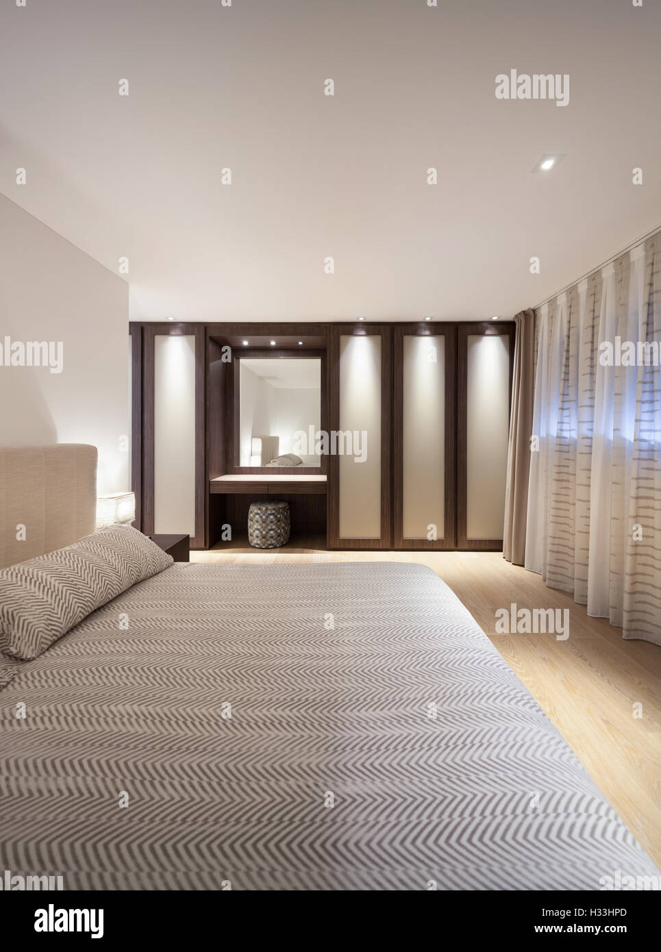 bedroom of luxury house, comfortable double bed Stock Photo Alamy