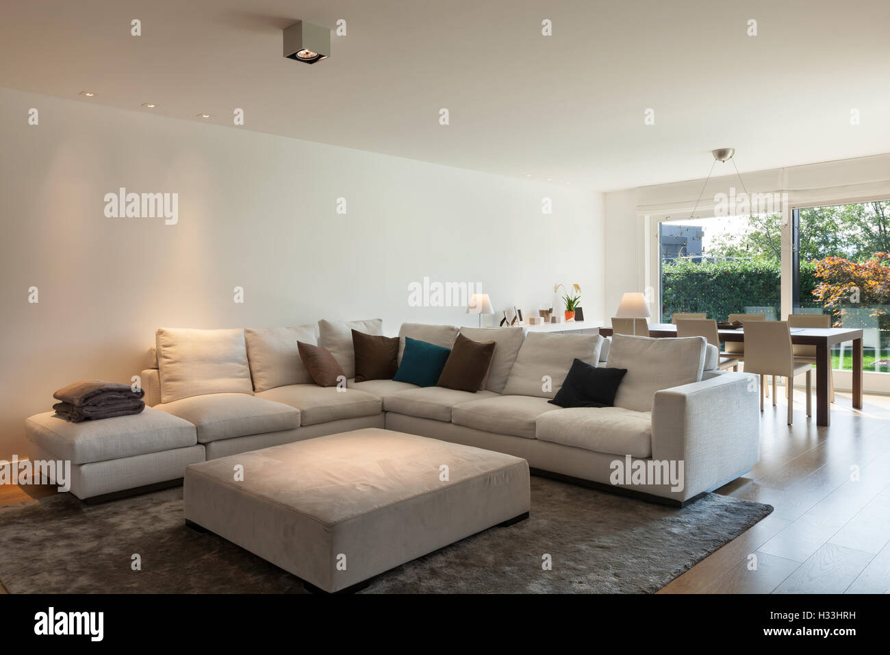 living room of luxury house, comfortable divans Stock Photo Alamy