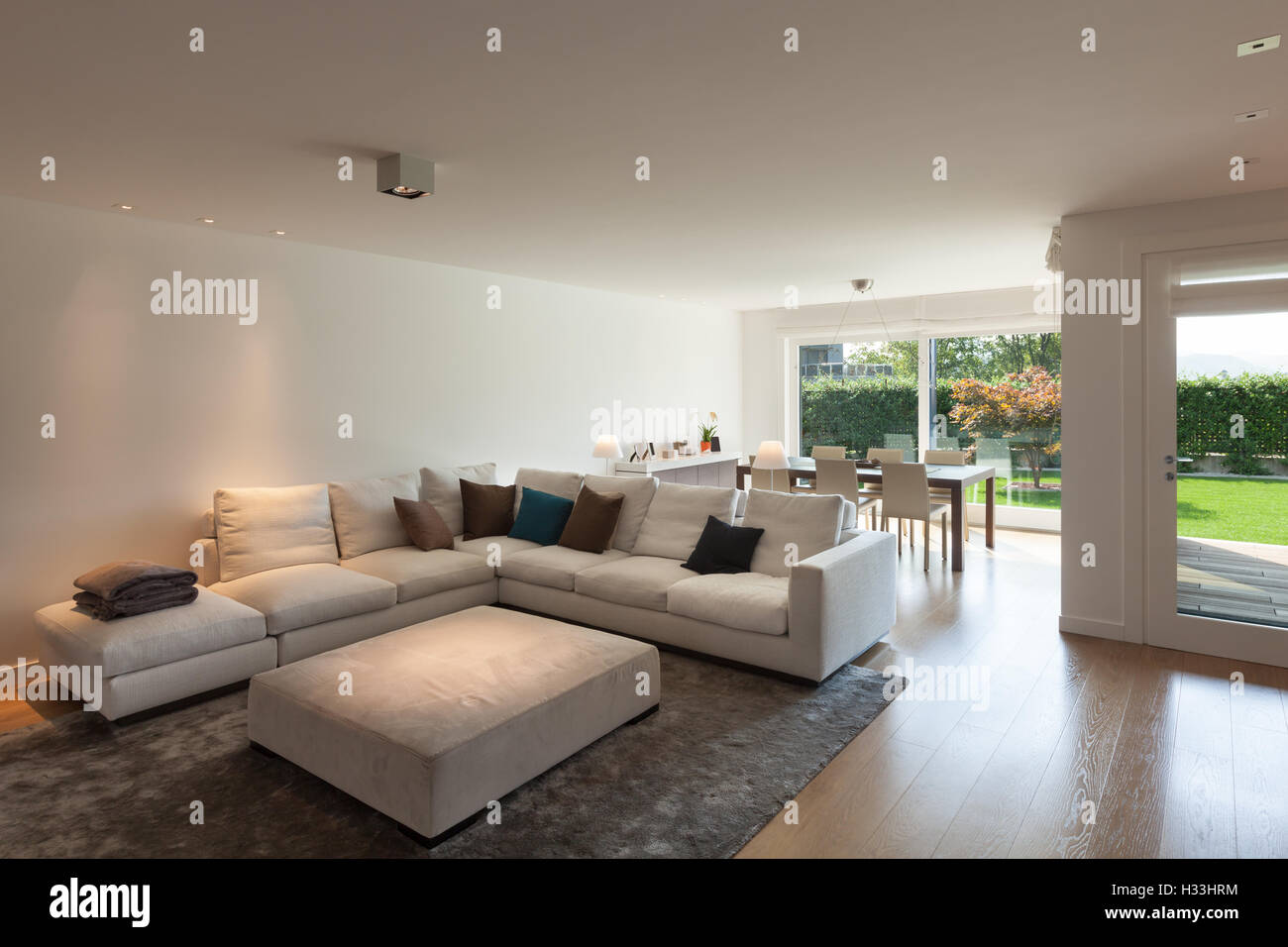 living room of luxury house, comfortable divans Stock Photo Alamy