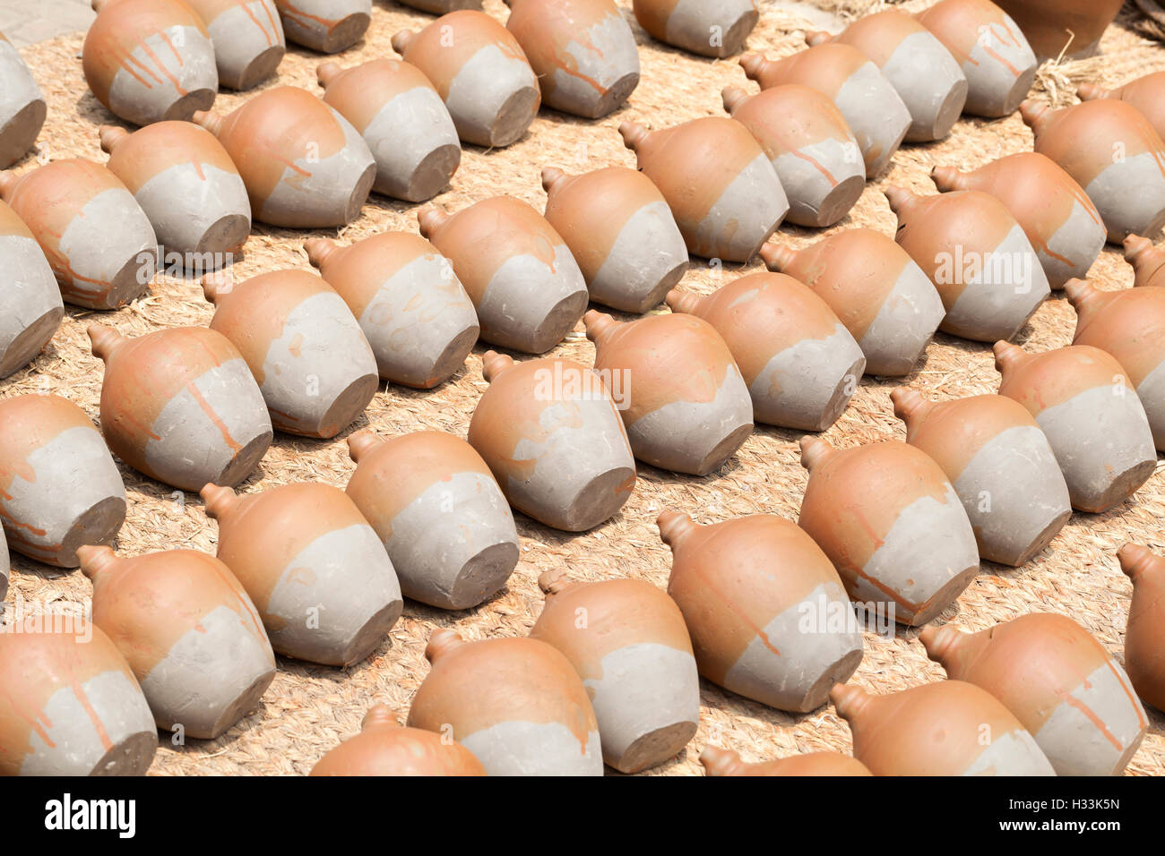 Rows of pots drying in the sun in potters square, Bhaktapur, Nepal Stock Photo