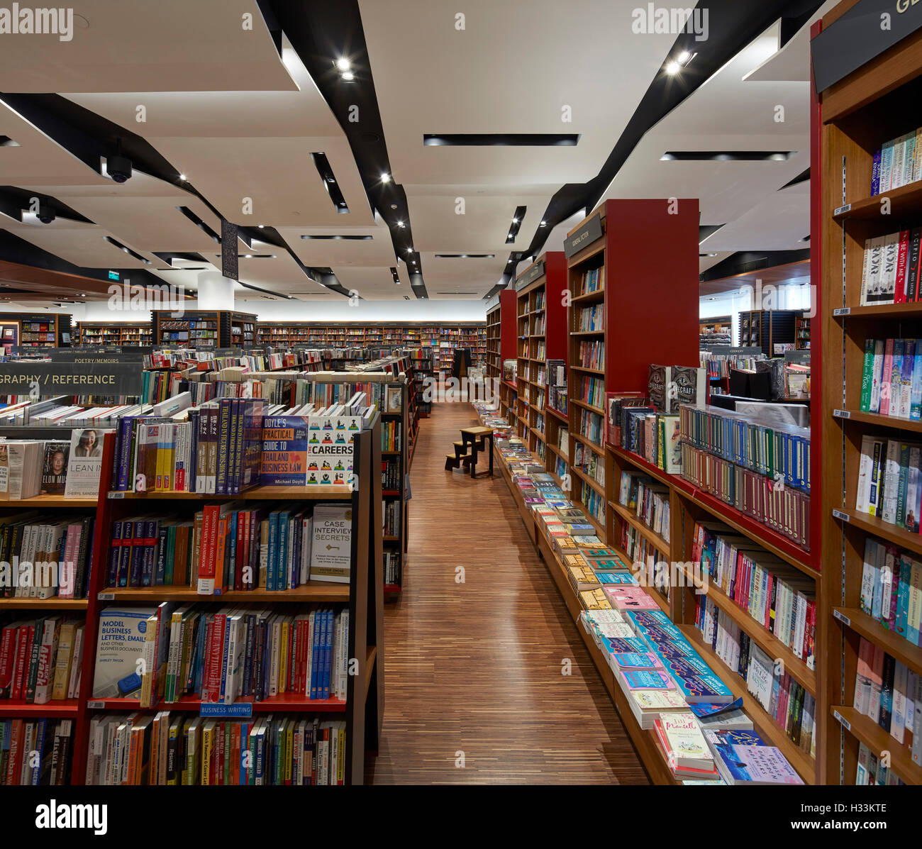 Folded ceiling feature and display shelves. Kinokuniya EmQuartier