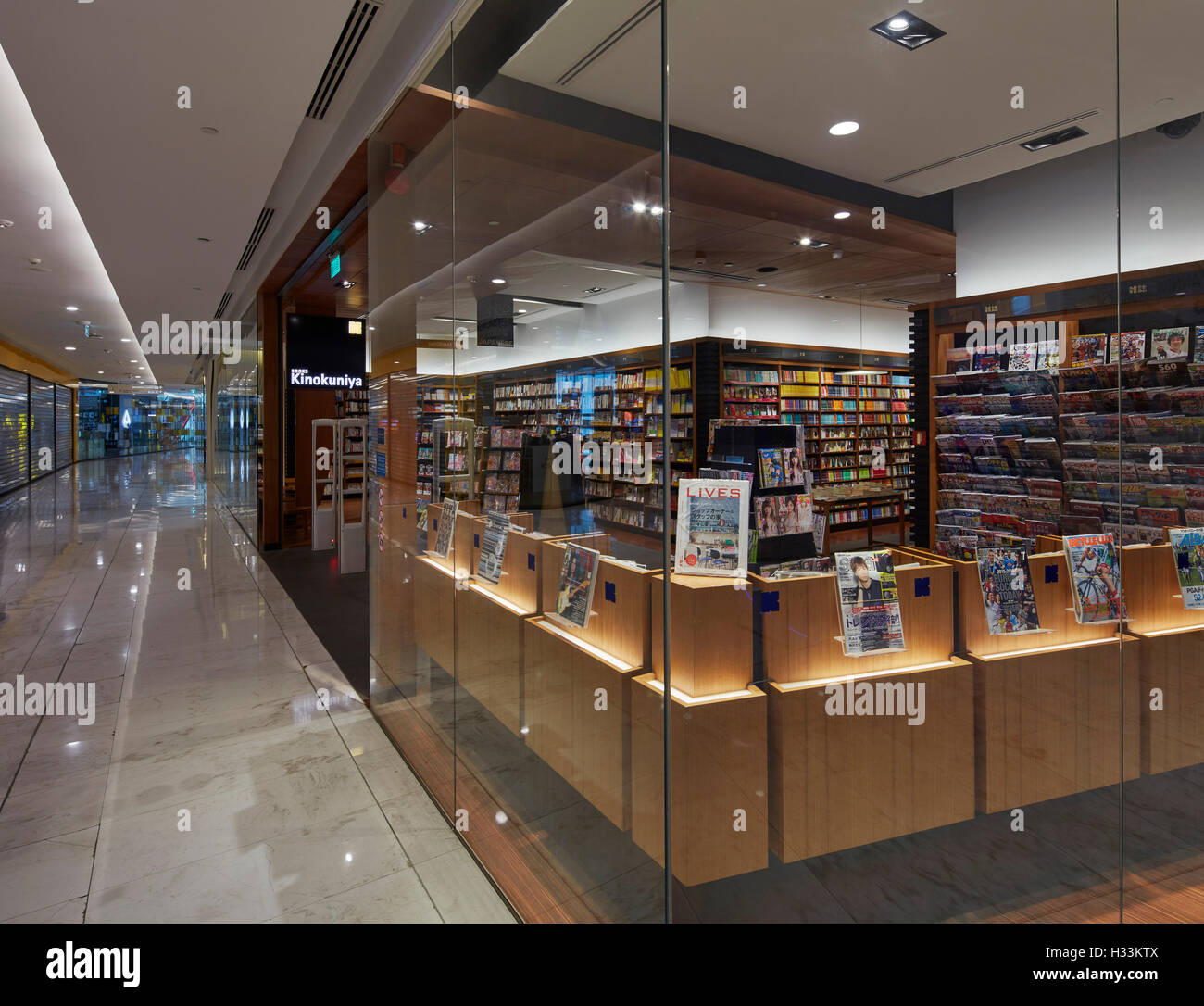 Corner elevation of glazed bookstore interior. Kinokuniya EmQuartier