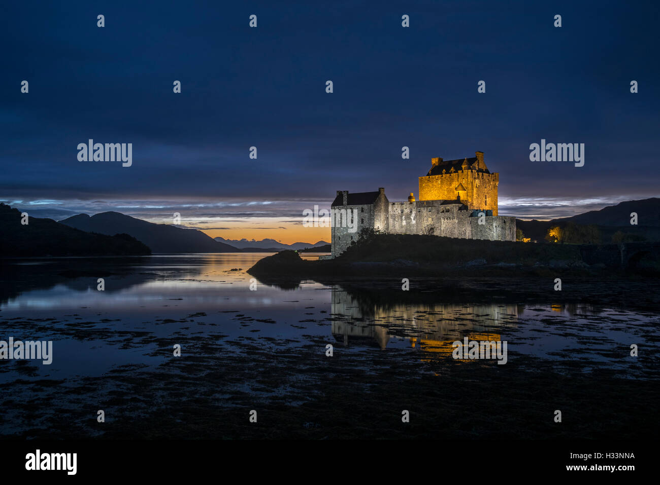 Illuminated Eilean Donan Castle at night in Loch Duich, Ross and Cromarty, Western Highlands of Scotland, UK Stock Photo