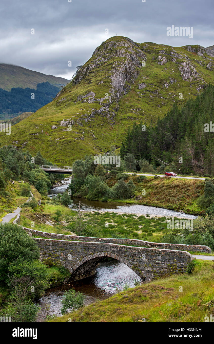 Remnants of the old military road and bridge over the river Shiel in Glen Shiel, Kintail, Scottish Highlands, Scotland, UK Stock Photo