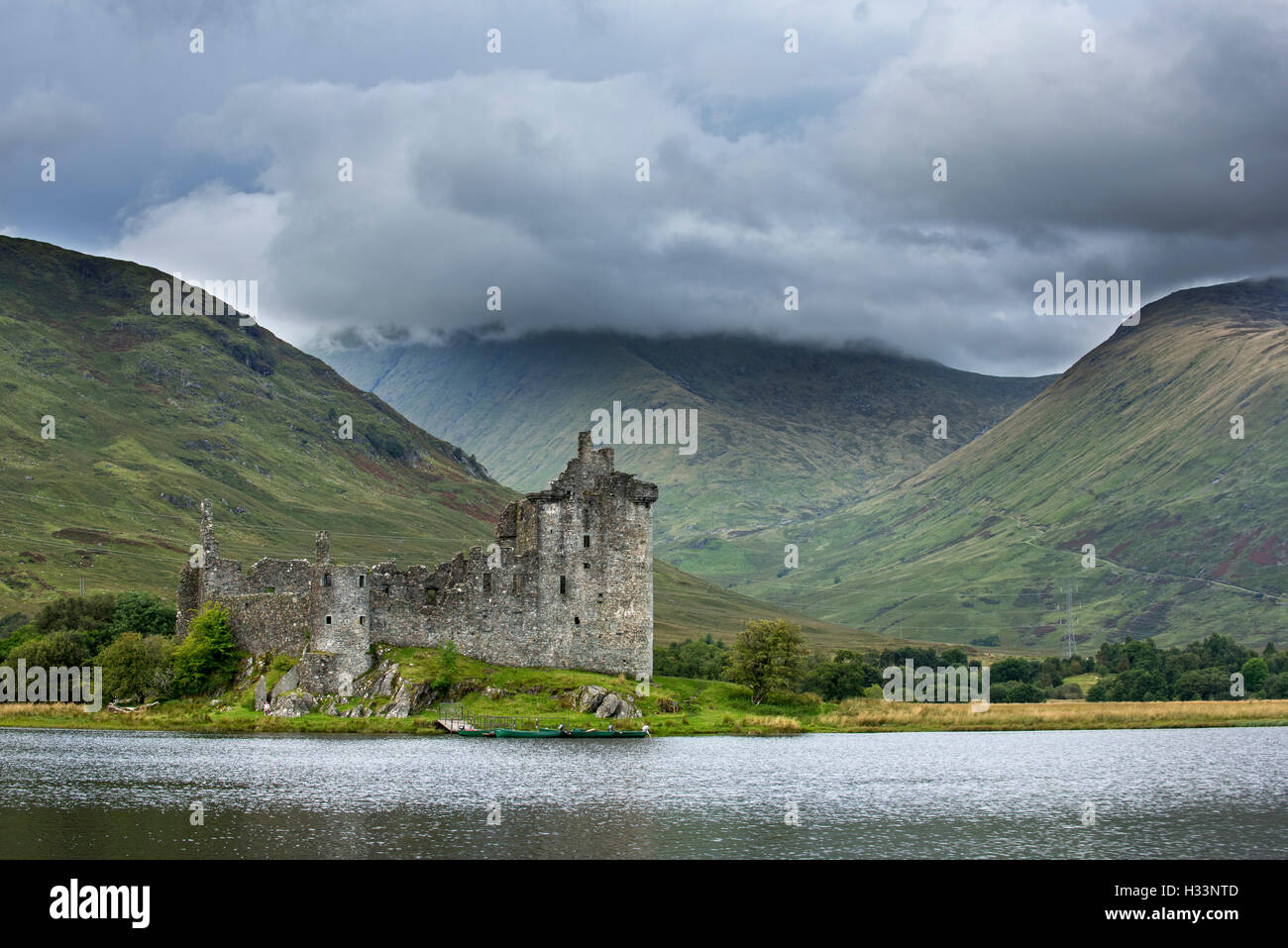 Rain clouds over Kilchurn Castle ruin along Loch Awe, Argyll and Bute, Scotland, UK Stock Photo