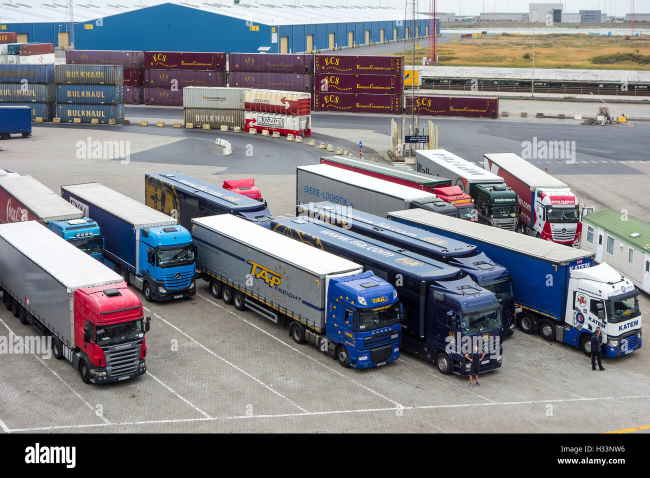 Containers and trucks waiting to board roll-on/roll-off / roro freight ship in the port of Zeebrugge, Belgium Stock Photo