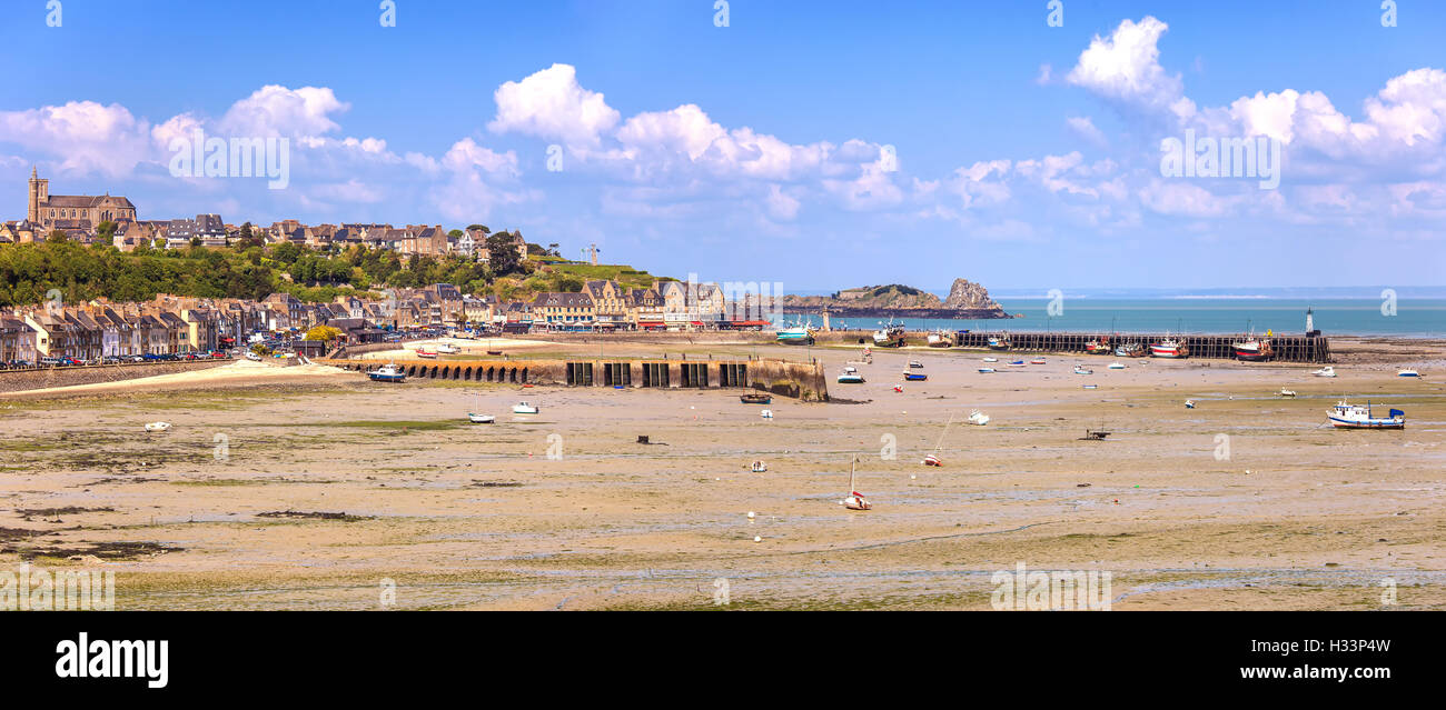 Low tide in Cancale village and fishing port. Pier and boat. Brittany, France. Europe. Stock Photo