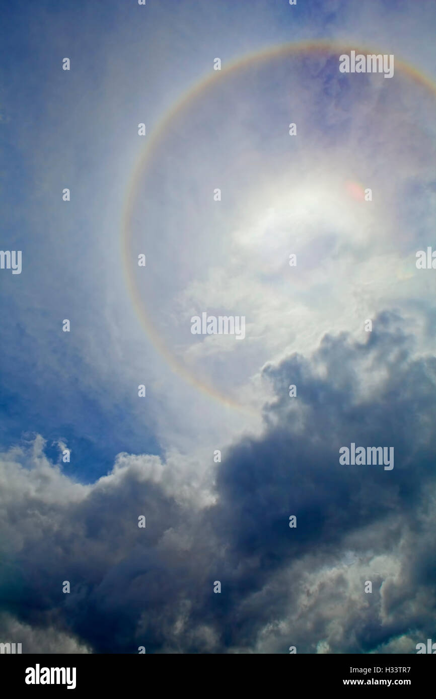 Halo around the sun with storm clouds in an Alaskan sky. Stock Photo