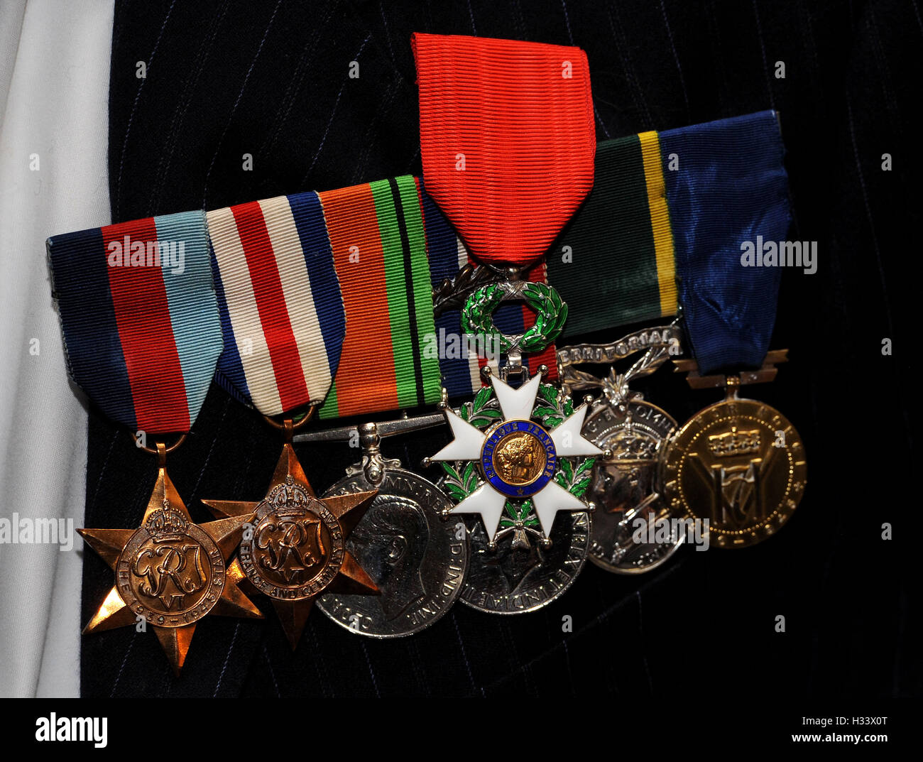 The Legion d'honneur, France's highest distinction, sit on top of other campaign medals as fourteen veterans were honoured for their role in securing France's liberation during the Second World War, with many having taken part in the June 1944 D-Day landings, given to them by the French Ambassador Sylvie Bermann during a ceremony at the Ambassador's residence in Kensington, London. Stock Photo