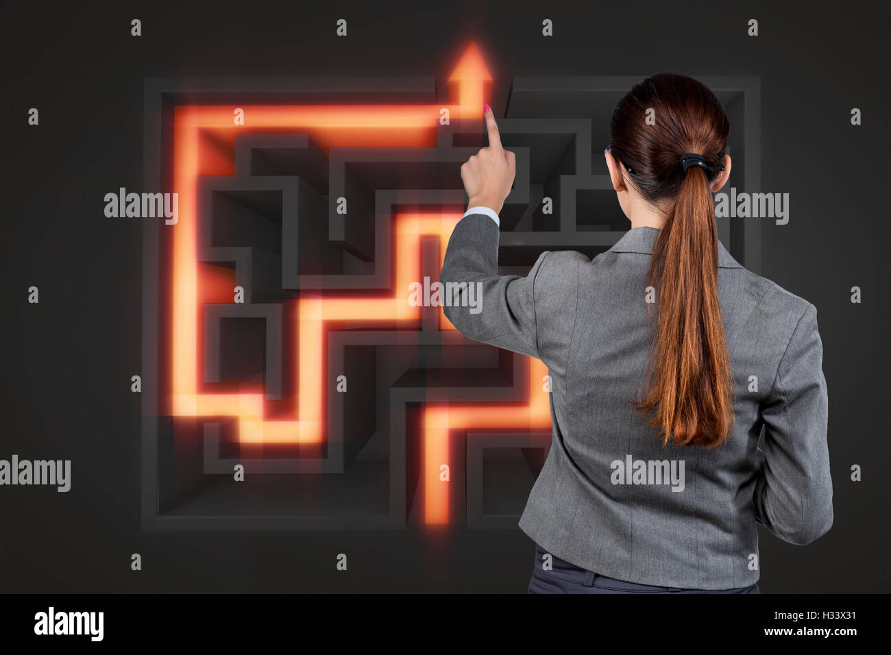 Businesswoman with maze in difficult situations concept Stock Photo - Alamy