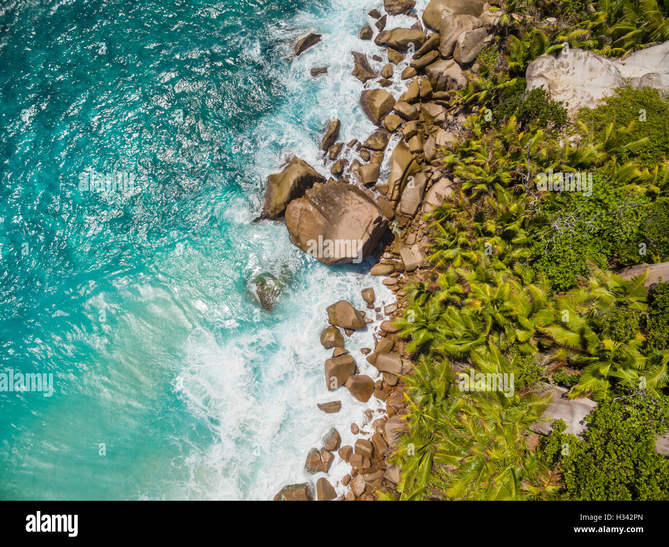 Aerial photo of Seychelles tropical beach Anse Source D Argent at La Digue island Stock Photo