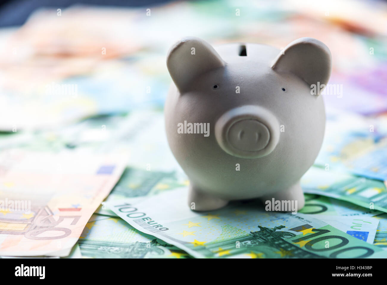 pig money box with cash closeup Stock Photo