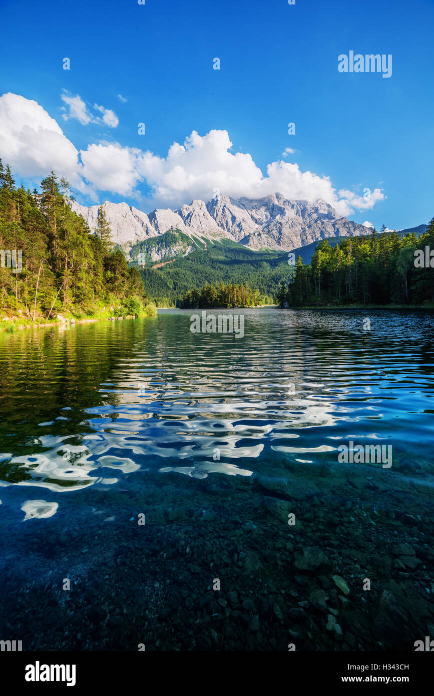 Fantastic day on mountain lake Eibsee, located in the Bavaria, Germany. Dramatic unusual scene. Alps, Europe. Stock Photo