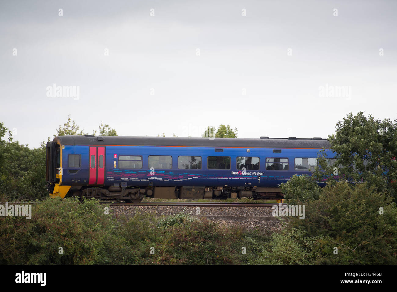 A First Great Western (FGW) commuter train on a railway line. Stock Photo