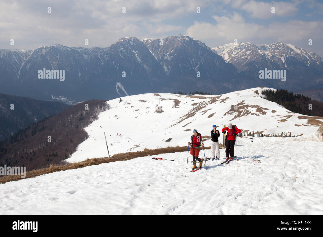 Tourists are seen skiing on the slopes of Baiului Carpathian mountains Stock Photo