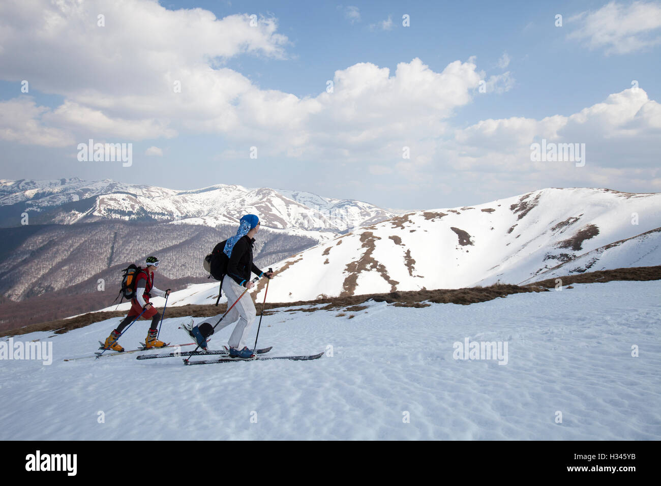 Tourists are seen skiing on the slopes of Baiului Carpathian mountains Stock Photo