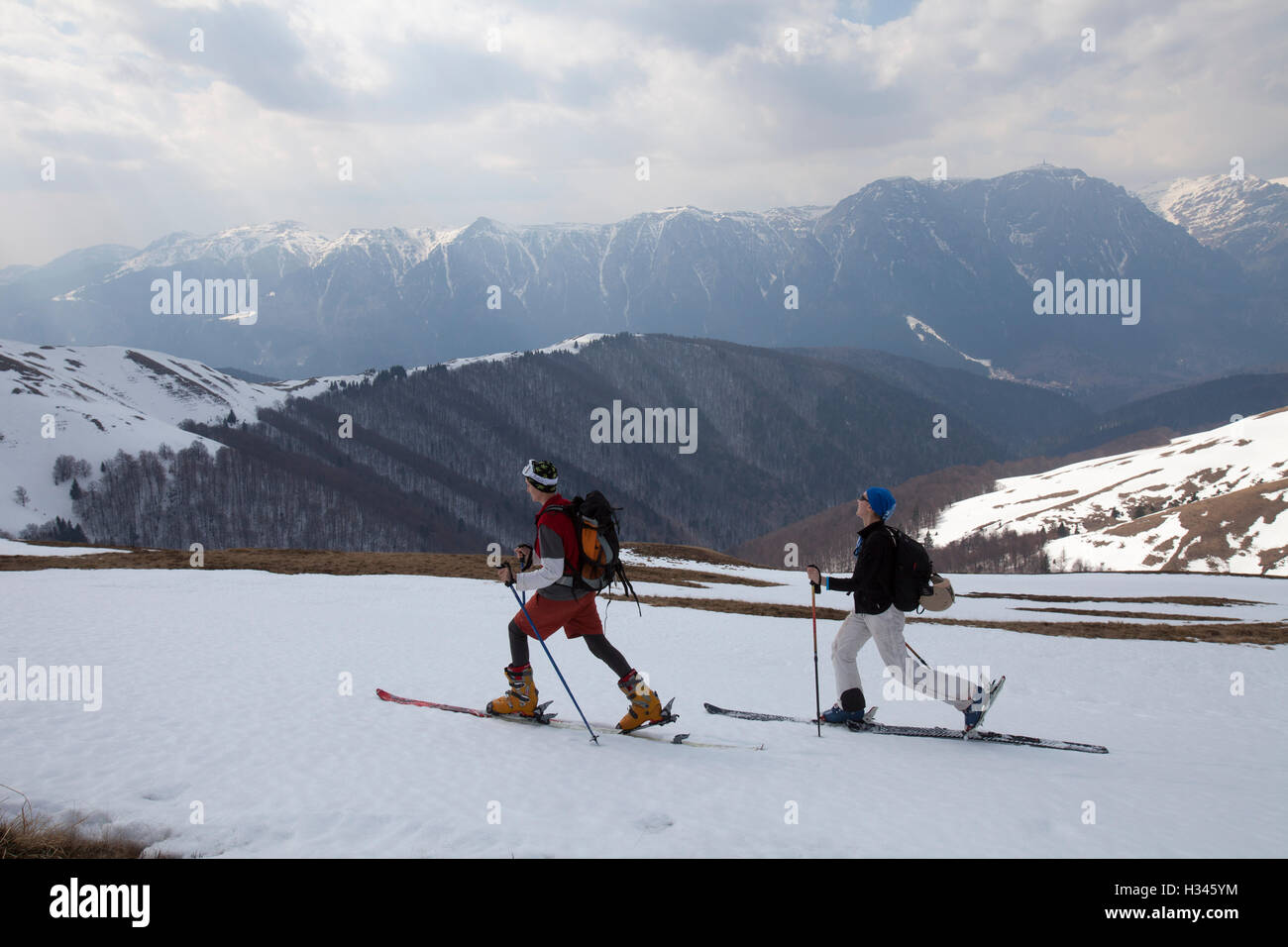Tourists are seen skiing on the slopes of Baiului Carpathian mountains Stock Photo
