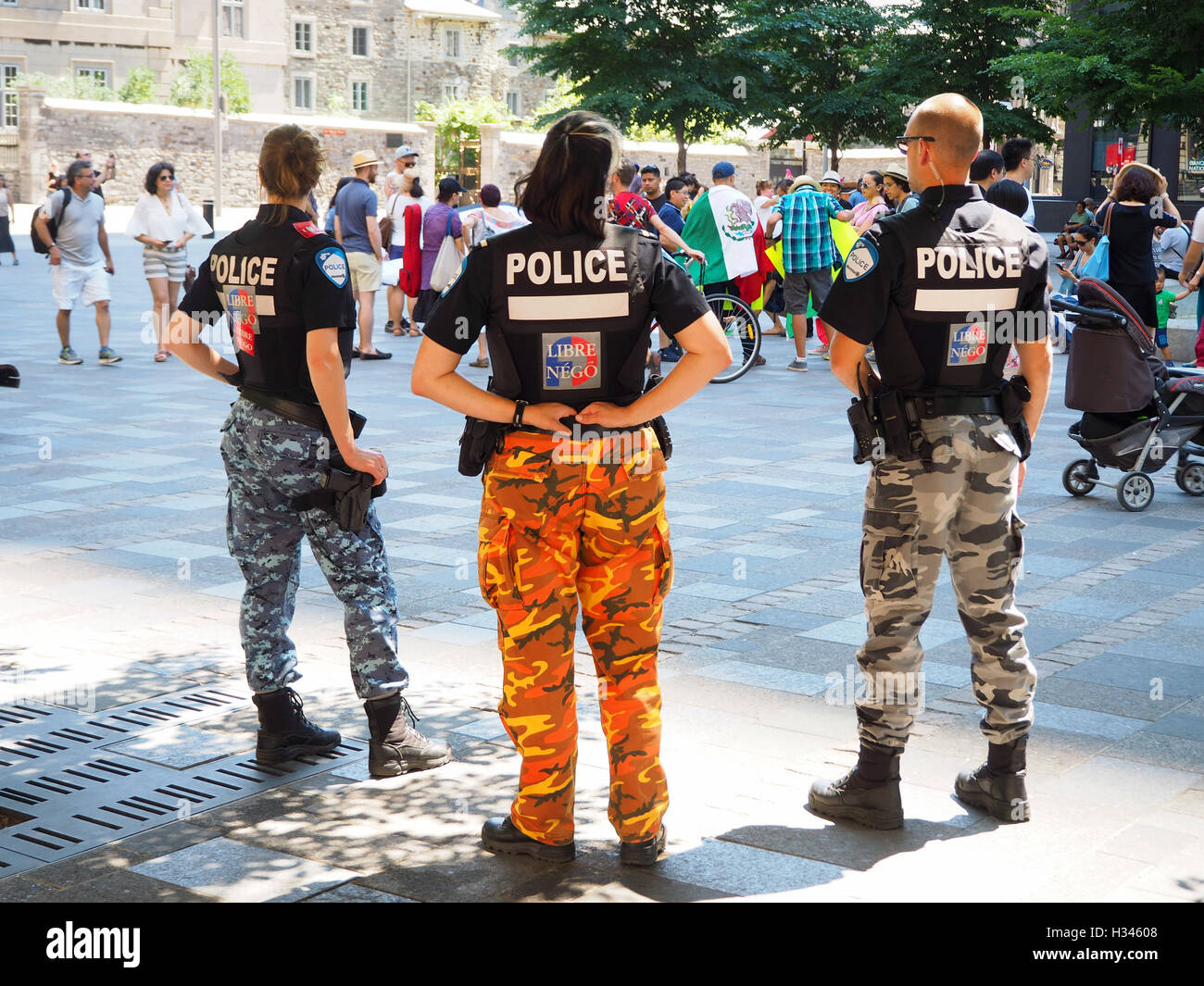 Police officers wearing combat pants, Montreal, Quebec, Canada Stock Photo