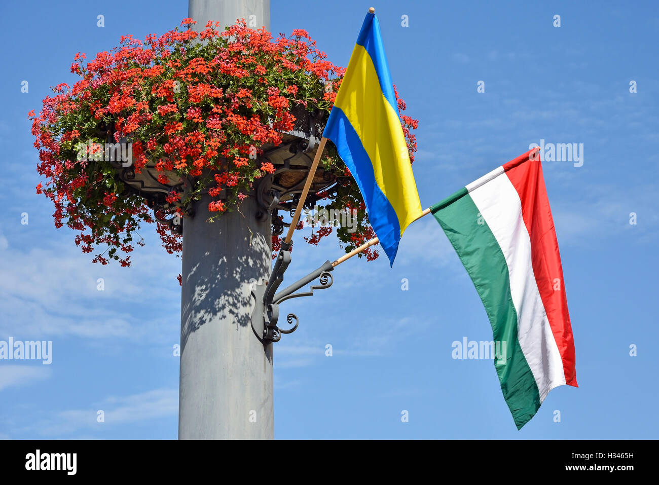 Hungarian flag and flowers on a pole Stock Photo