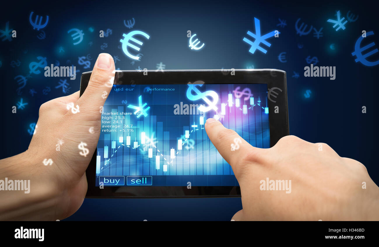 finger point on investment tablet Stock Photo