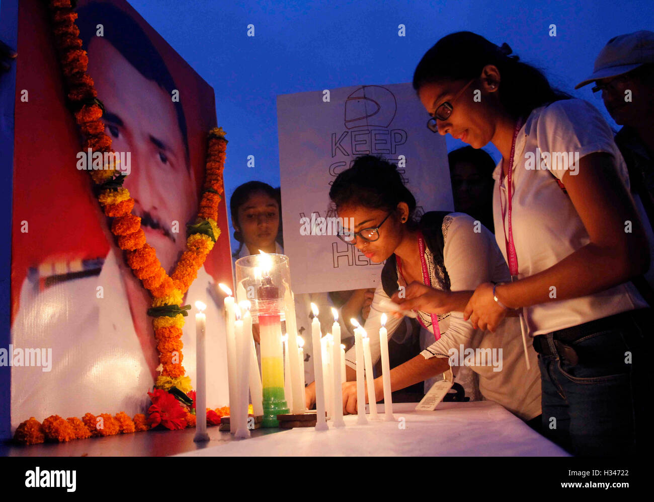 Students of Sydenham College participate in a candlelight march as a tribute to traffic policeman Vilas Shinde in Mumbai Stock Photo