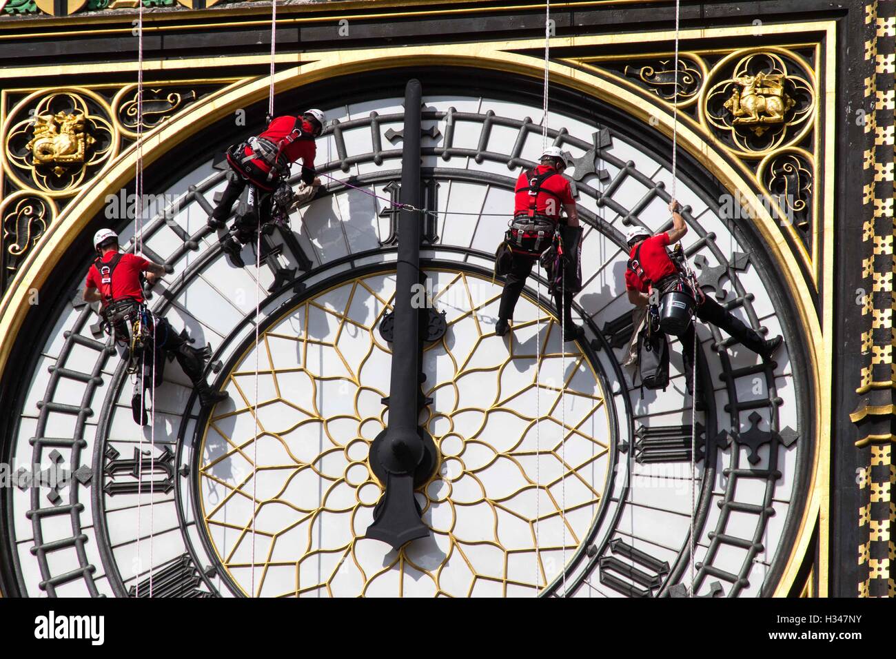 Cleaners wash the South face of the Elizabeth Tower,commonly known as Big Ben.The clock face is cleaned every 10 years Stock Photo