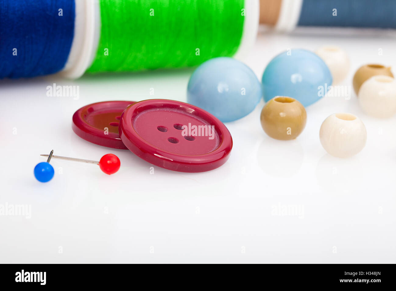 buttons, thread and needle. sewing accessories Stock Photo - Alamy