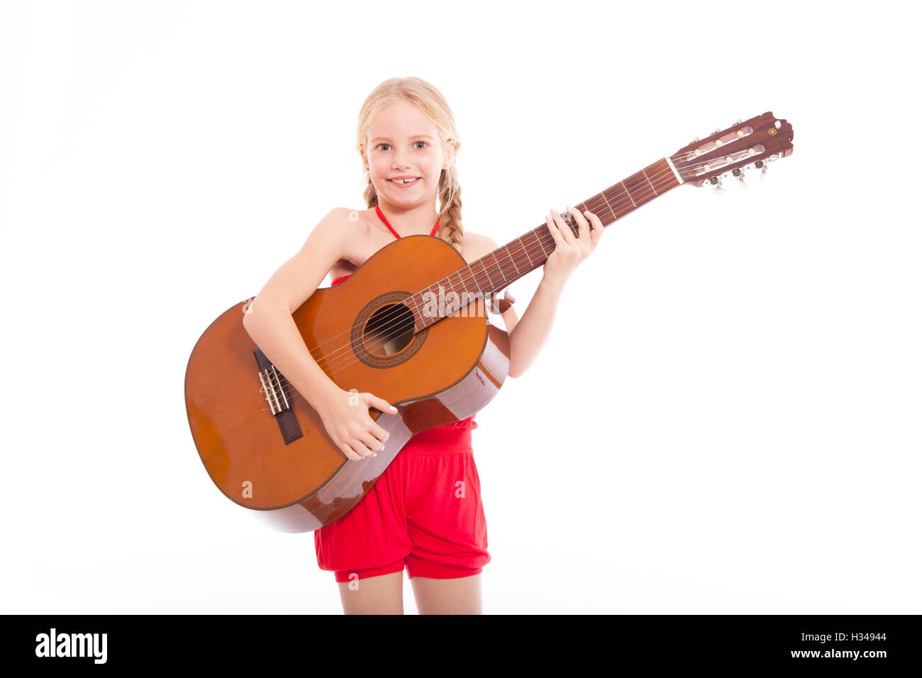 Girl standing with guitar hi-res stock photography and images - Alamy