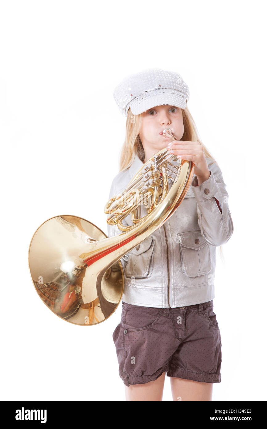 young girl with cap playing french horn Stock Photo Alamy