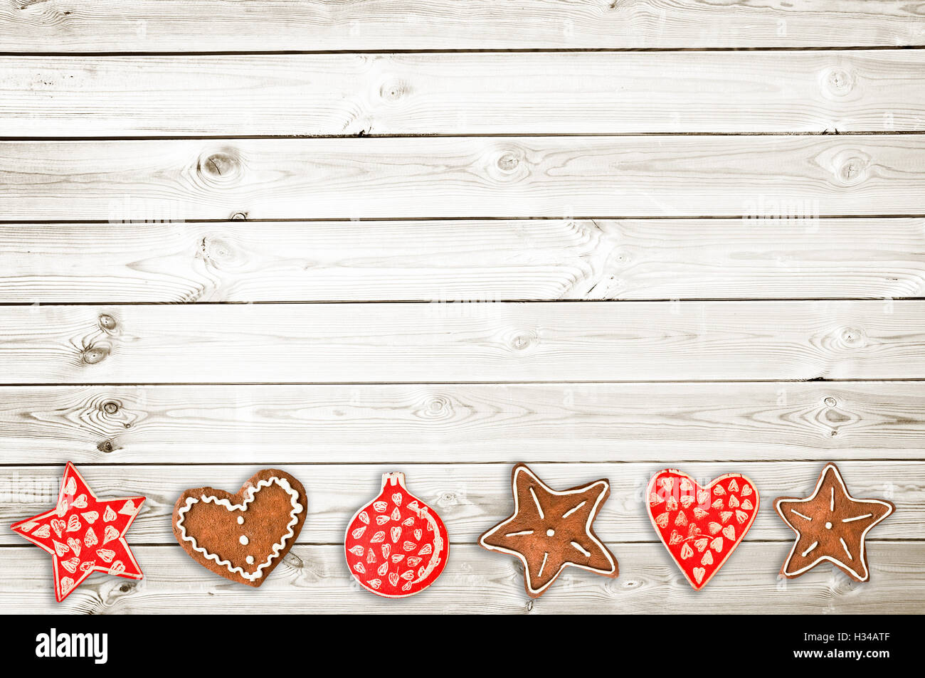 Ginger bread cookies and Christmas ornaments on white wooden planks background Stock Photo