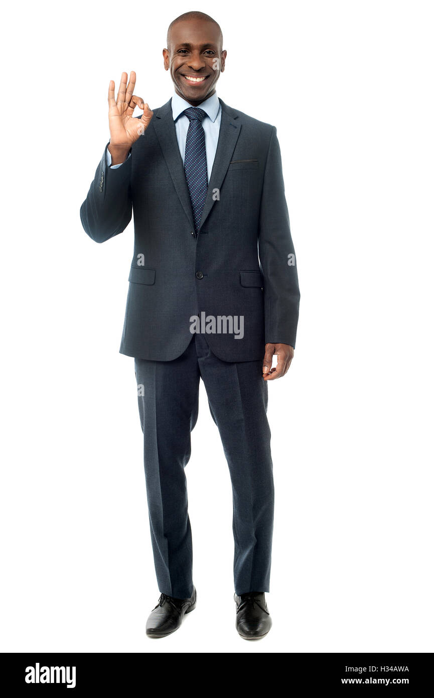 Businessman showing okay sign Stock Photo - Alamy