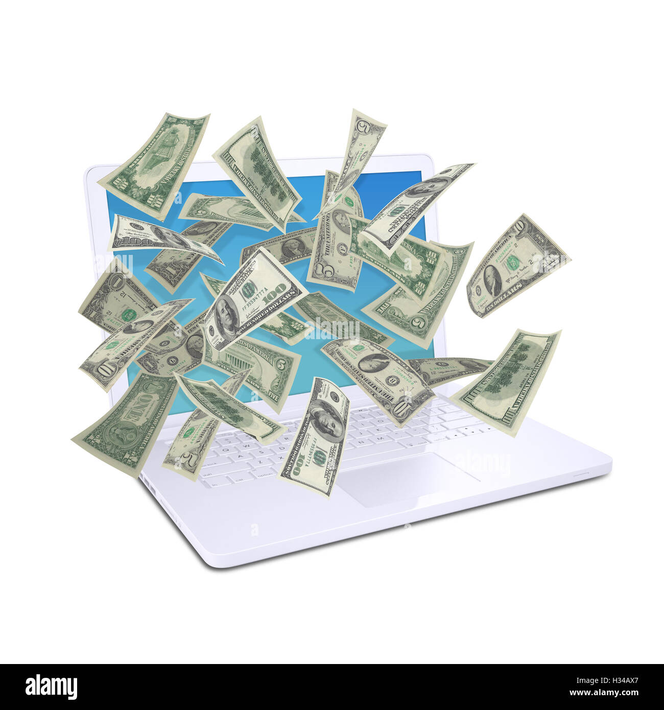 Dollar notes flying around the laptop Stock Photo - Alamy