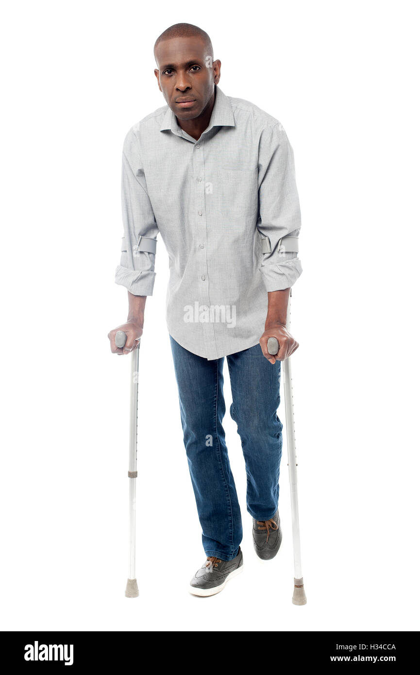 African man with crutches trying to walk Stock Photo Alamy