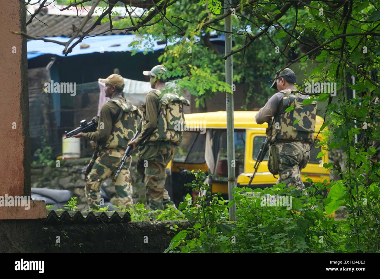 Force One commandos conduct a search and combing operation in a slum area of Uran, about 47 km East of Mumbai, India September Stock Photo
