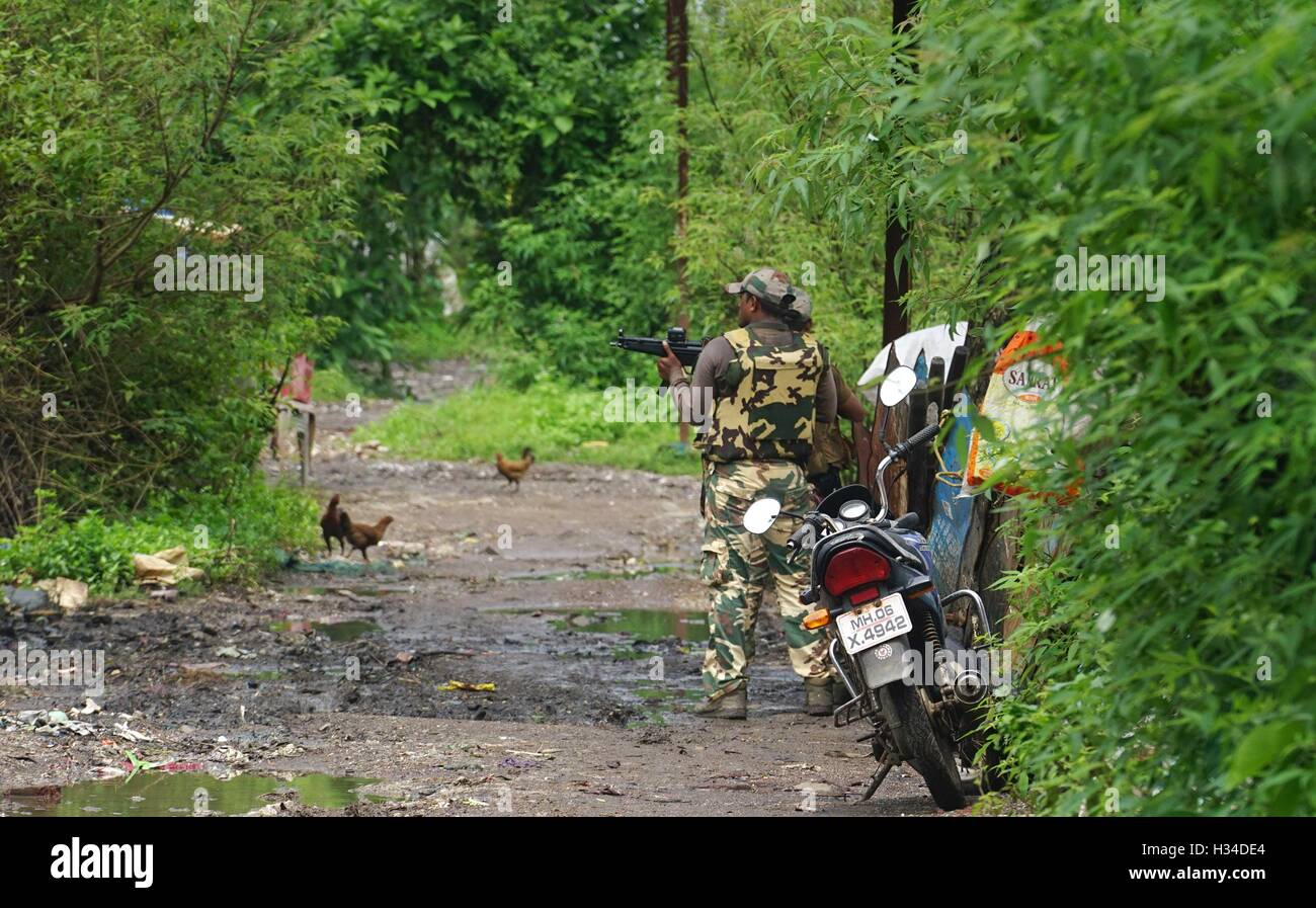 Force One commando conducts a search and combing operation slum area of Uran about 47 km East of Mumbai India Stock Photo
