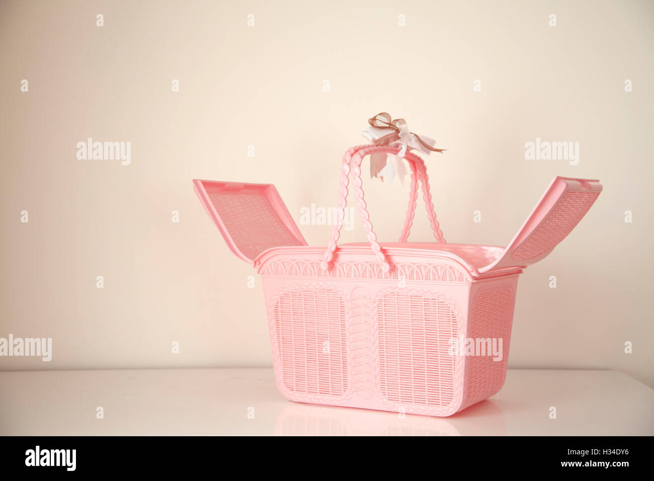 Open Pink basket with copy space on background Stock Photo Alamy