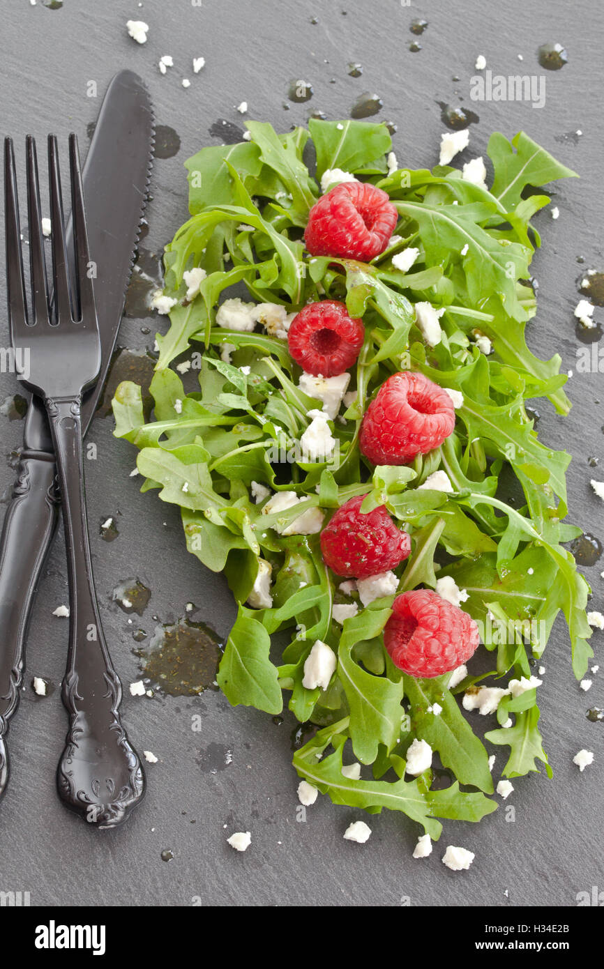 Arugula with feta and raspberries Stock Photo Alamy