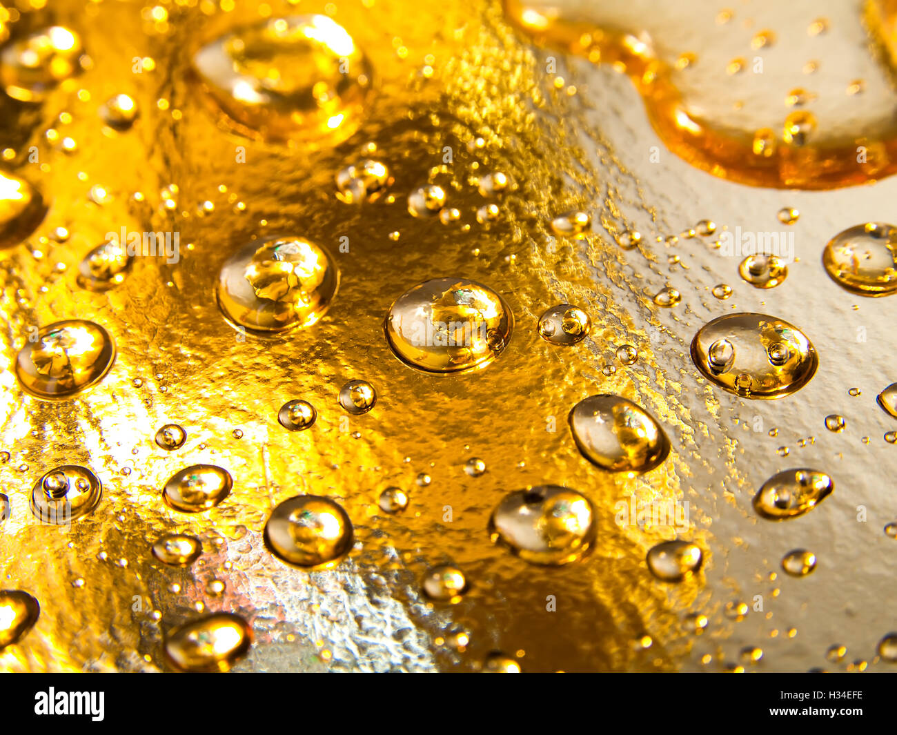 drops of water on golden background Stock Photo - Alamy