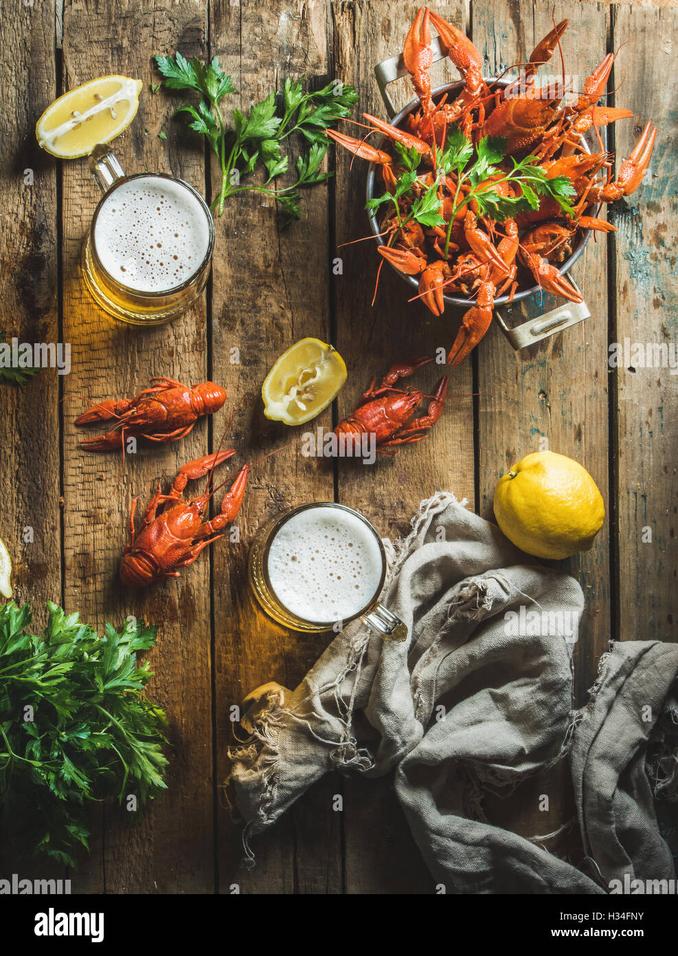 Wheat beer and boiled crayfish with lemon, parsley Stock Photo Alamy
