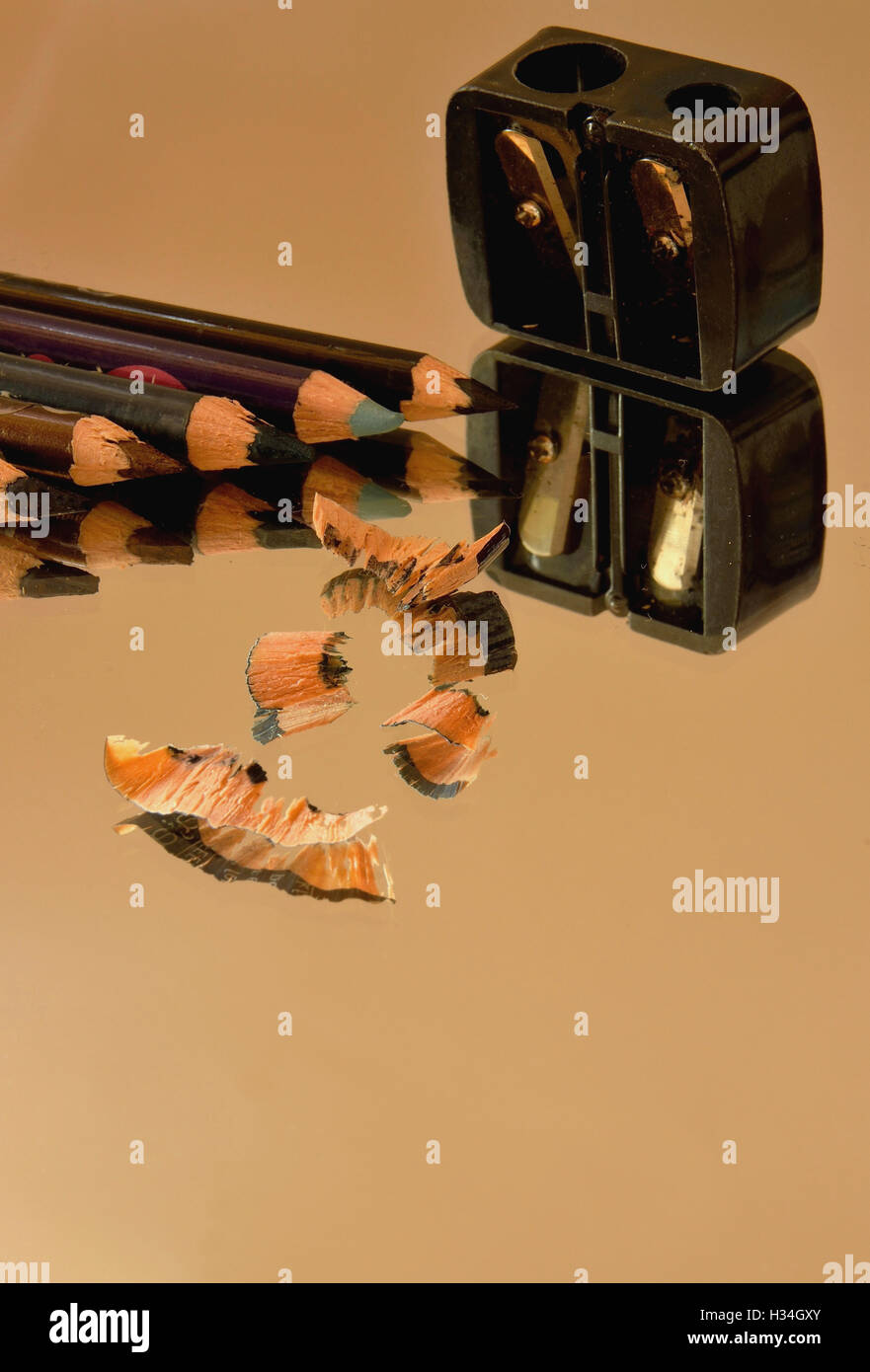 Eye pencils, sharpener and their reflection in the mirror Stock Photo