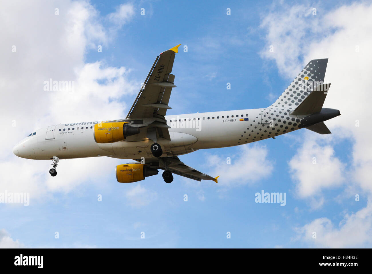 Vueling Airbus A320-214 approaching London Heathrow airport. Stock Photo