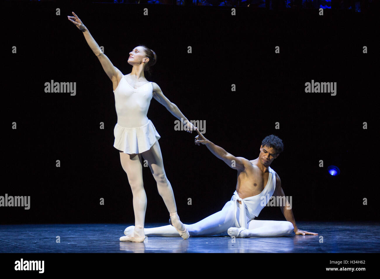 London, UK. 3 October 2016. Carlos Acosta performs the classical Pas de Deux from Stravinsky's Apollo with Marianela Nunez. Choreography by George Balanchine. Carlos Acosta bids farewell to classical ballet with his final performances at the Royal Albert Hall for a limited run from 3 to 7 October 2016. The Classical Farewell celebrates highlights from Acosta's career which led him to become the most famous male dancer of his generation, and marks the final time for audiences to watch the ballet superstar dance classical works. Stock Photo