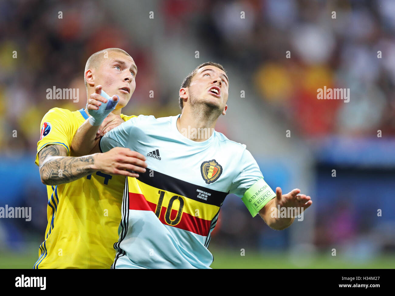 NICE, FRANCE - JUNE 22, 2016: Victor Lindelof of Sweden (L) fights for a ball with Eden Hazard of Belgium during their UEFA EURO 2016 game at Allianz Riviera Stade de Nice, City of Nice, France Stock Photo