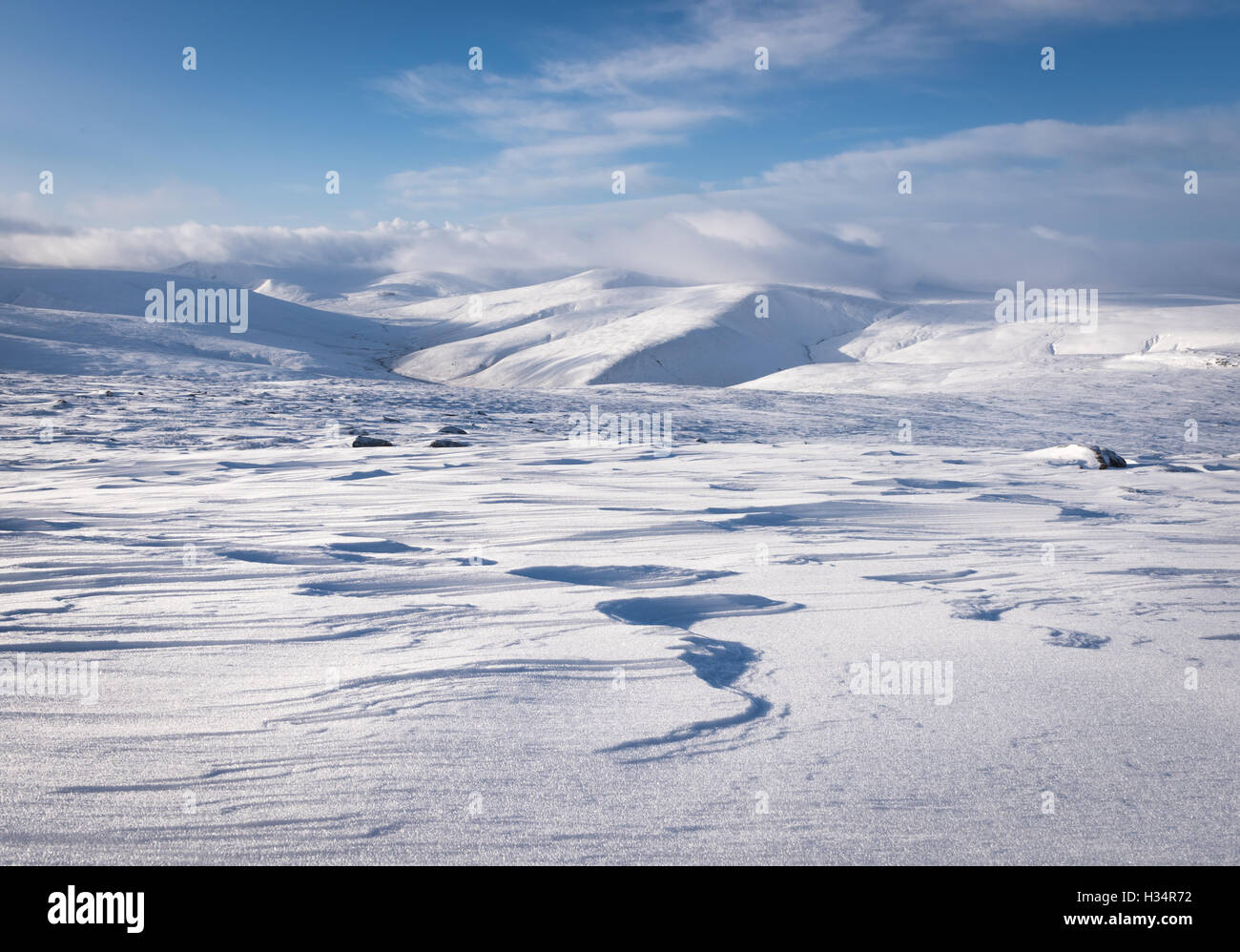 View from Carrock Fell towards Skiddaw House and Skiddaw in deep snow, winter in the English Lake District national park Stock Photo