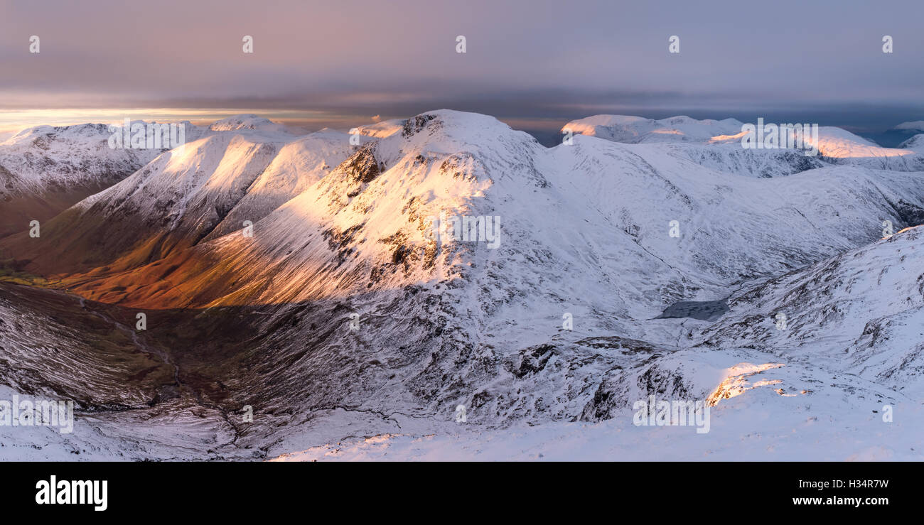 Late evening sunlight on Kirk Fell, Great Gable and Lake District mountains in winter, UK Stock Photo