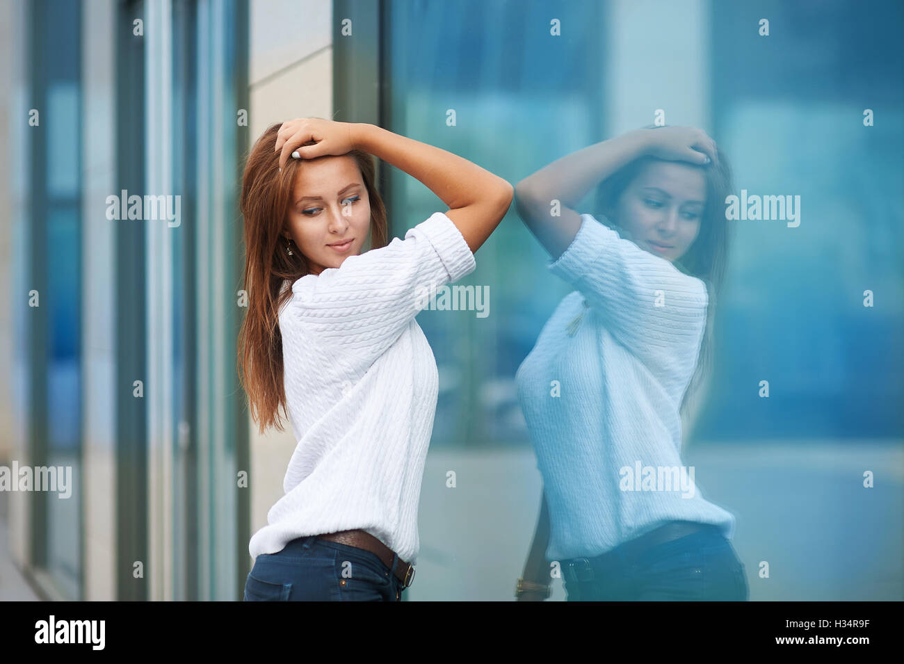 portrait of pretty young business woman near building Stock Photo