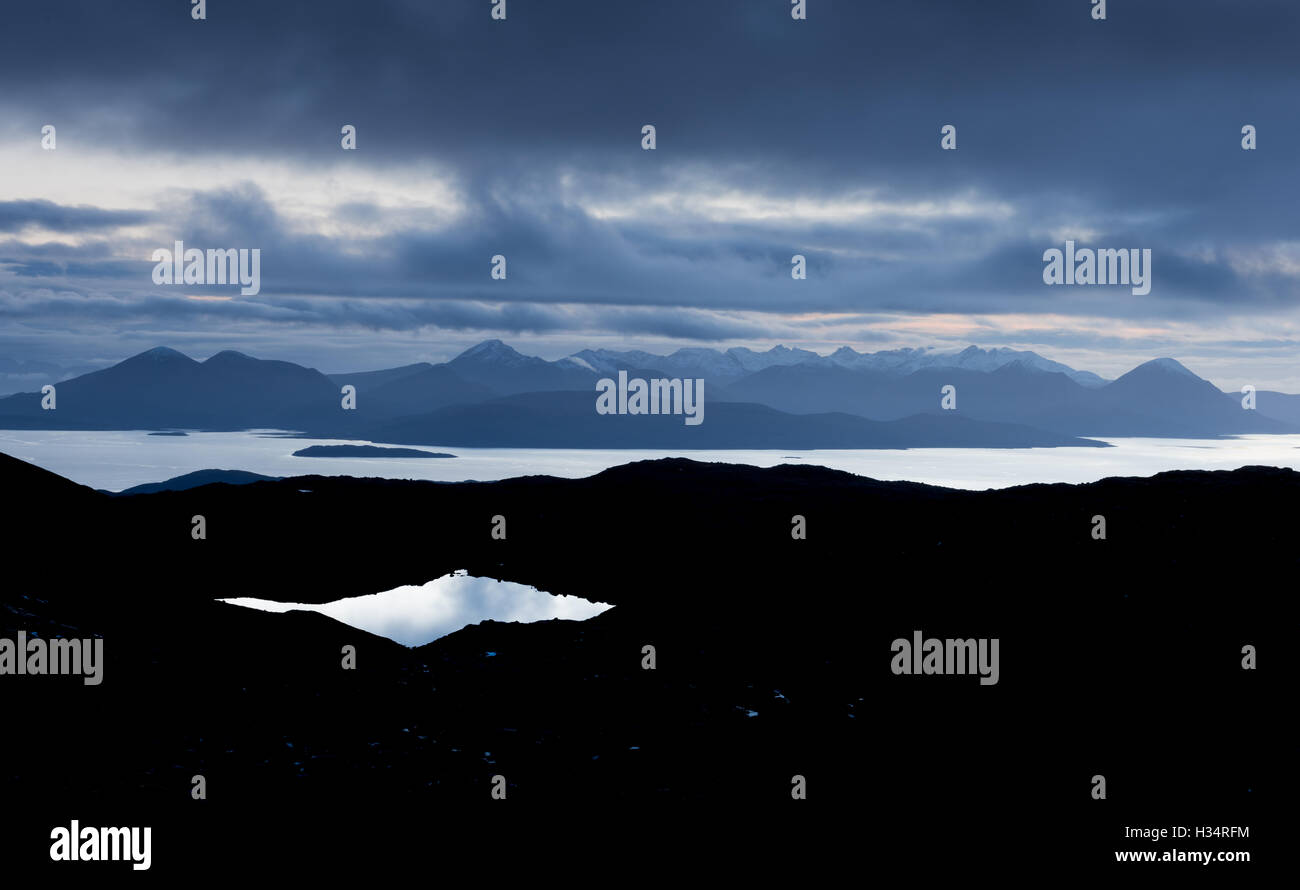 View from the Bealach na Ba towards the Isle of Skye after dark, Applecross Peninsula, Scottish Highlands Stock Photo